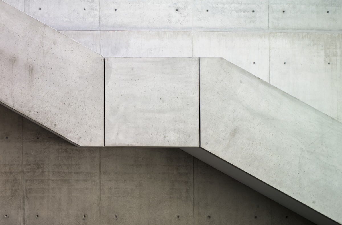Board-formed concrete plinth